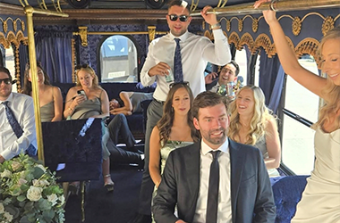 A white vintage-style Parlor Car Trolley inside view of event transportation